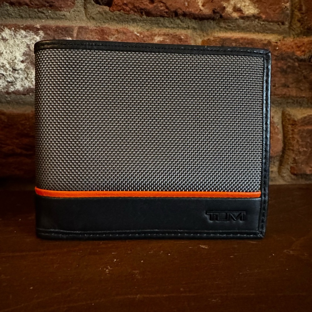 Tumi Gray and Black Card Holder with Orange Detail